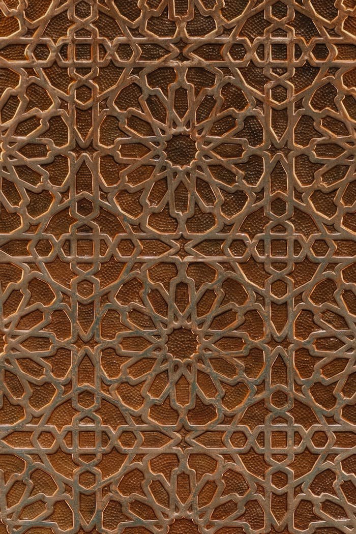 A detailed wooden panel showcasing traditional Islamic geometric design, ideal for decor and architecture inspiration.